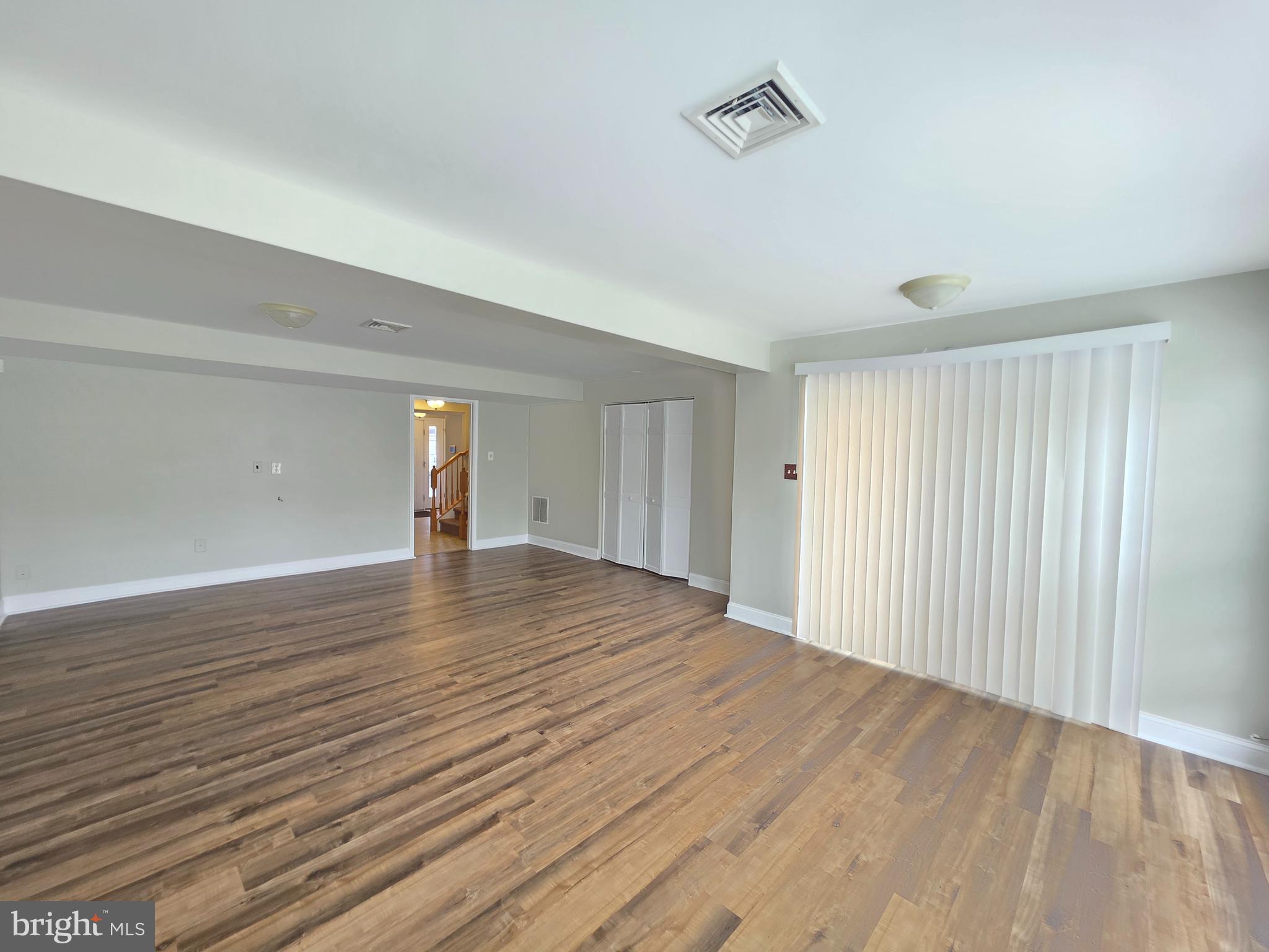 1002 Carlisle Road Egg Harbor Township, NJ 08234 - Photo 29 of 32 a view of empty room with wooden floor and fan