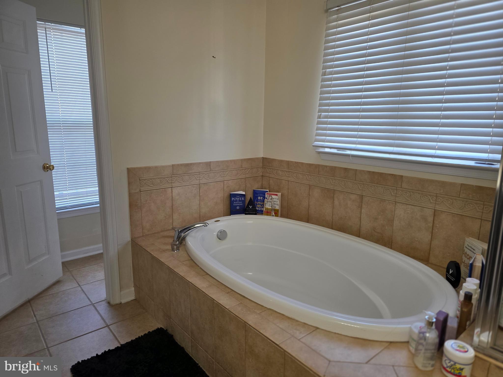 1002 Carlisle Road Egg Harbor Township, NJ 08234 - Photo 6 of 32 a white bath tub sitting in a bathroom