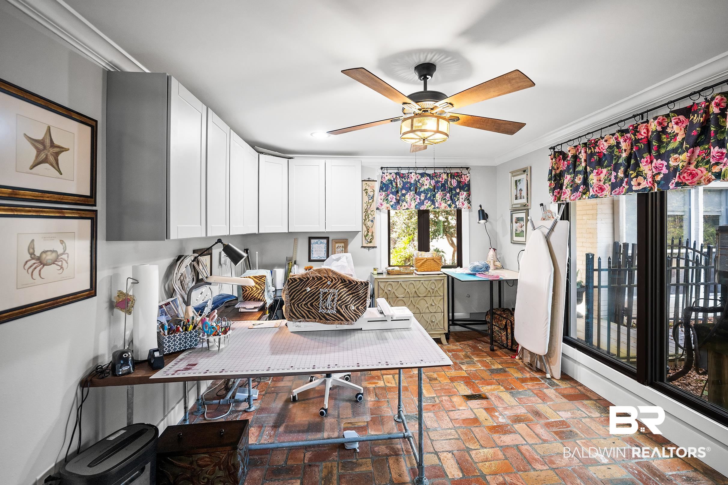 8490 Bay View Drive Foley, AL 36535 - Photo 29 of 67 Office area featuring brick floors, crown molding, and a ceiling fan