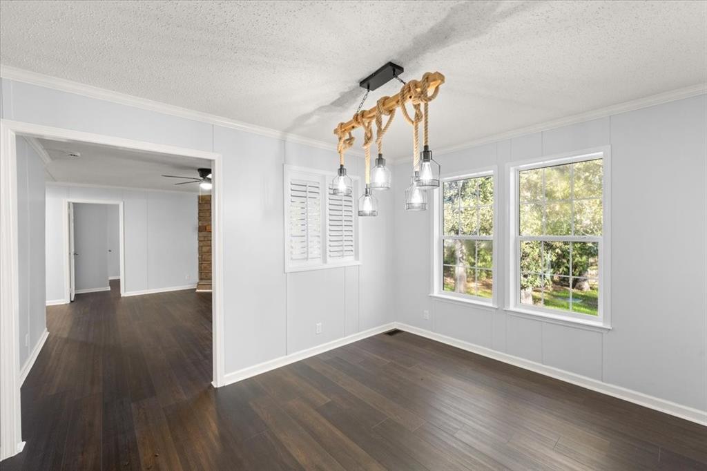 109 Summers Circle Azle, TX 76020 - Photo 12 of 32 a view of a livingroom with wooden floor and a window