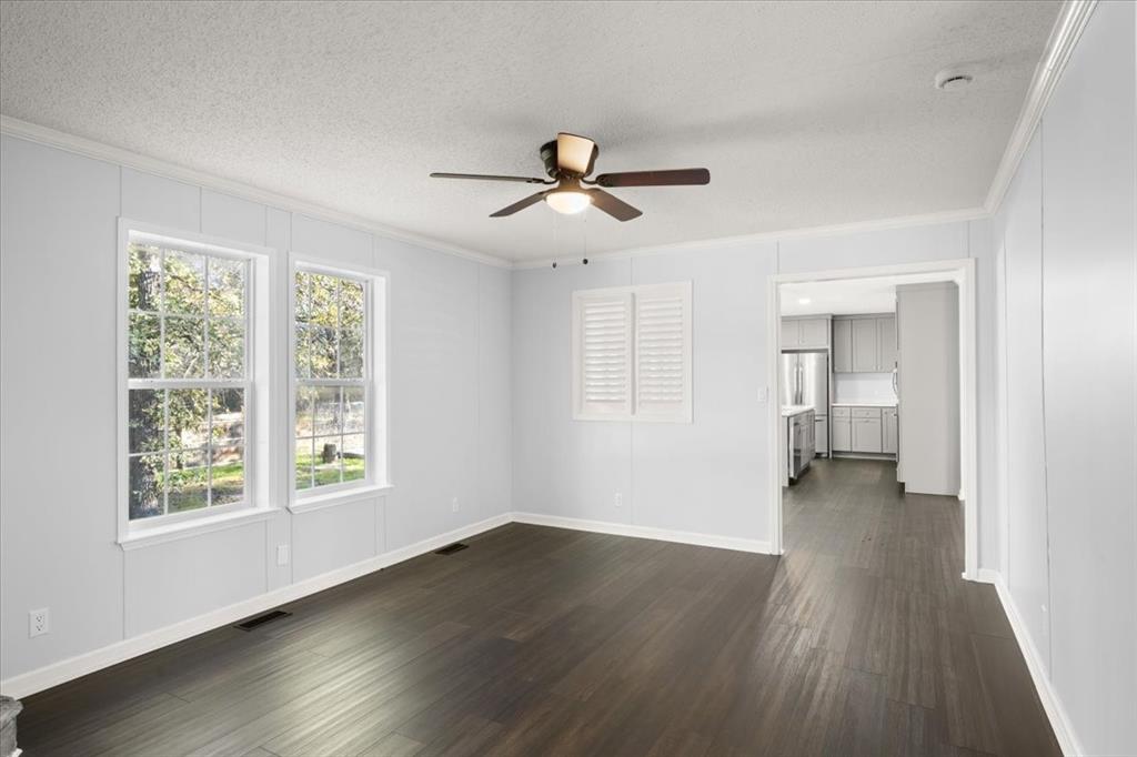 109 Summers Circle Azle, TX 76020 - Photo 14 of 32 wooden floor in an empty room with a window