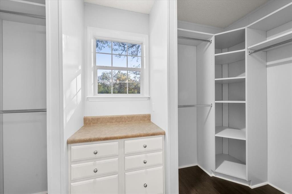 109 Summers Circle Azle, TX 76020 - Photo 19 of 32 a view of an empty room with cabinet and a window