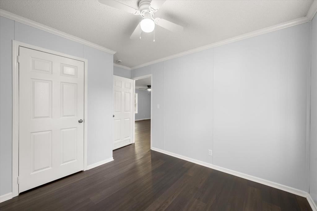 109 Summers Circle Azle, TX 76020 - Photo 25 of 32 an empty room with wooden floor and windows