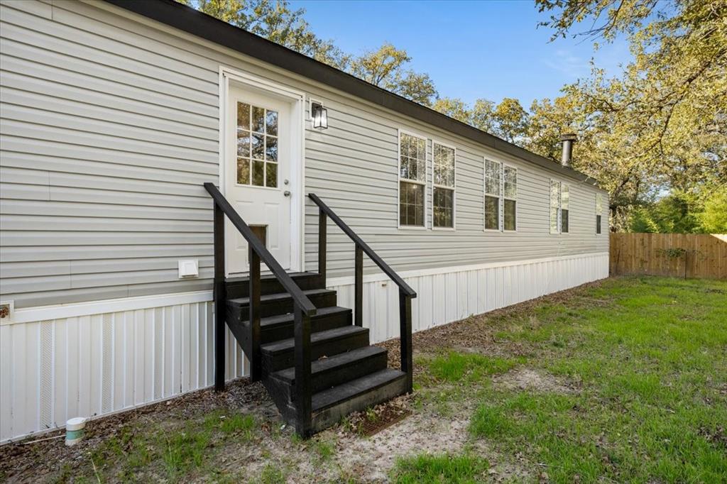 109 Summers Circle Azle, TX 76020 - Photo 32 of 32 a view of a house with backyard and wooden fence
