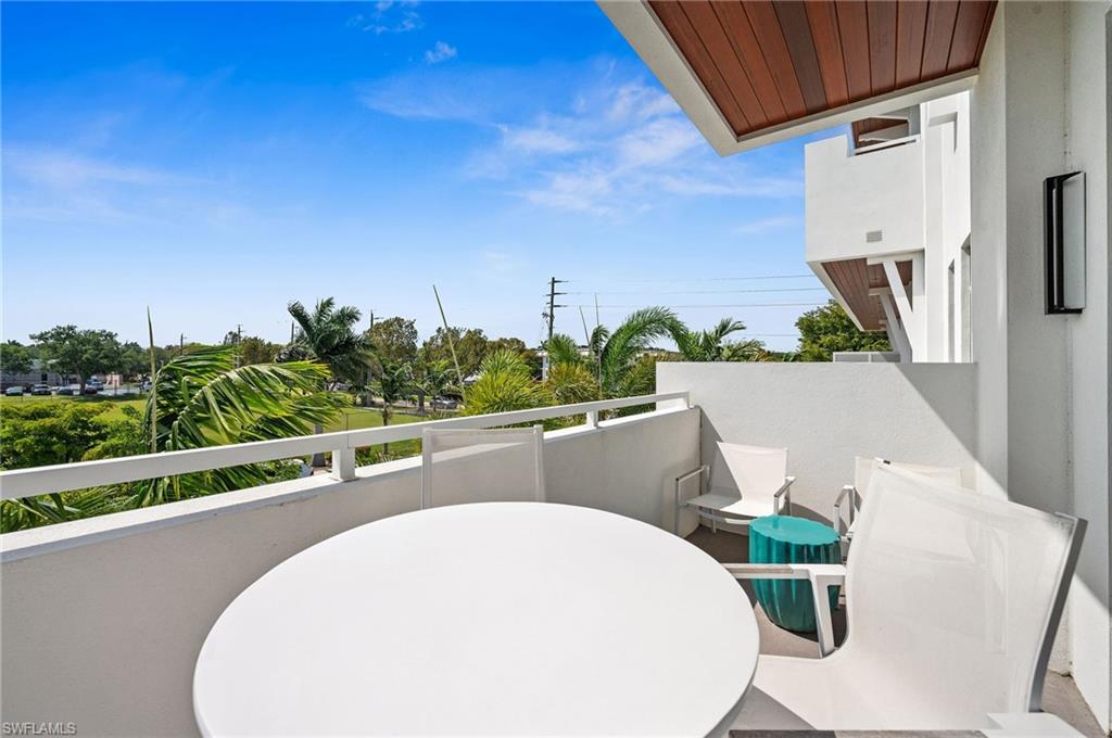 101 8th Street South, Unit 206 Naples, FL 34102 - Photo 4 of 26 a view of a dining room with furniture window and mountain view
