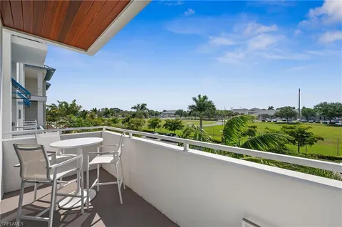 a view of balcony with furniture and city view