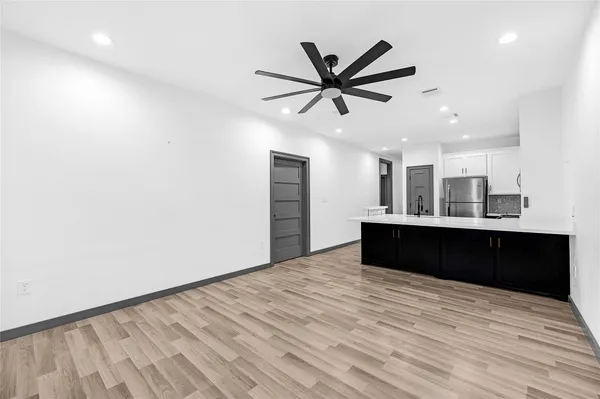 a bedroom with a bed and a mirror