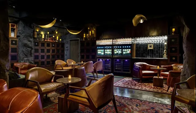 a dining room with furniture and chandelier