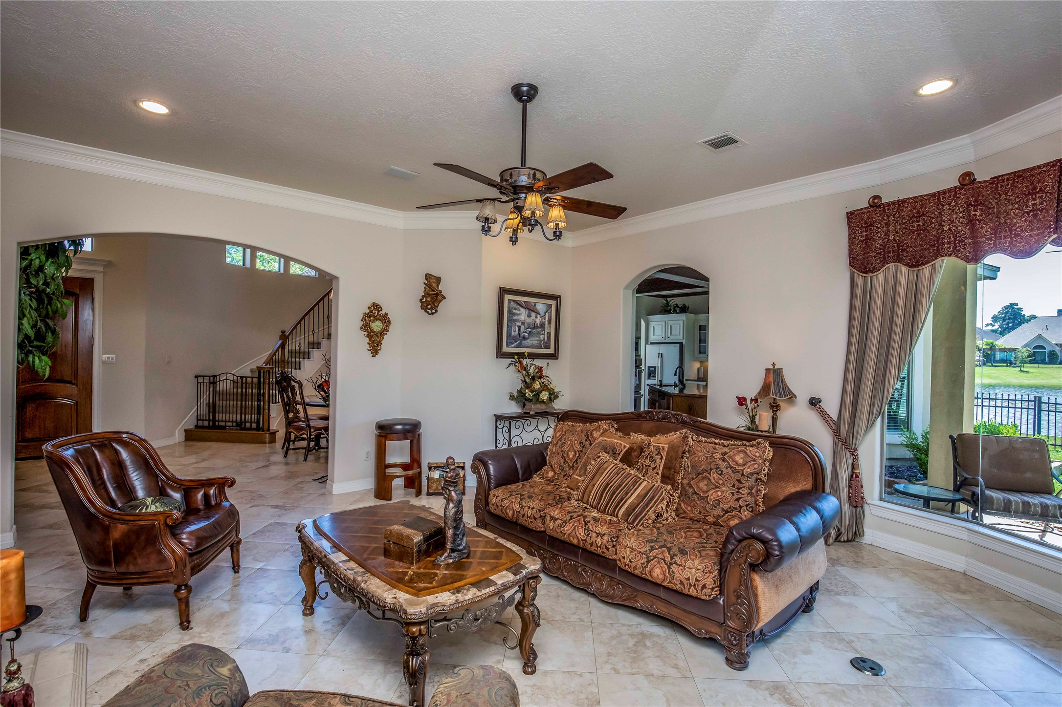 25219 Hideaway Run Drive Spring, TX 77389 - Photo 14 of 45 a bedroom with a bed and ceiling fan