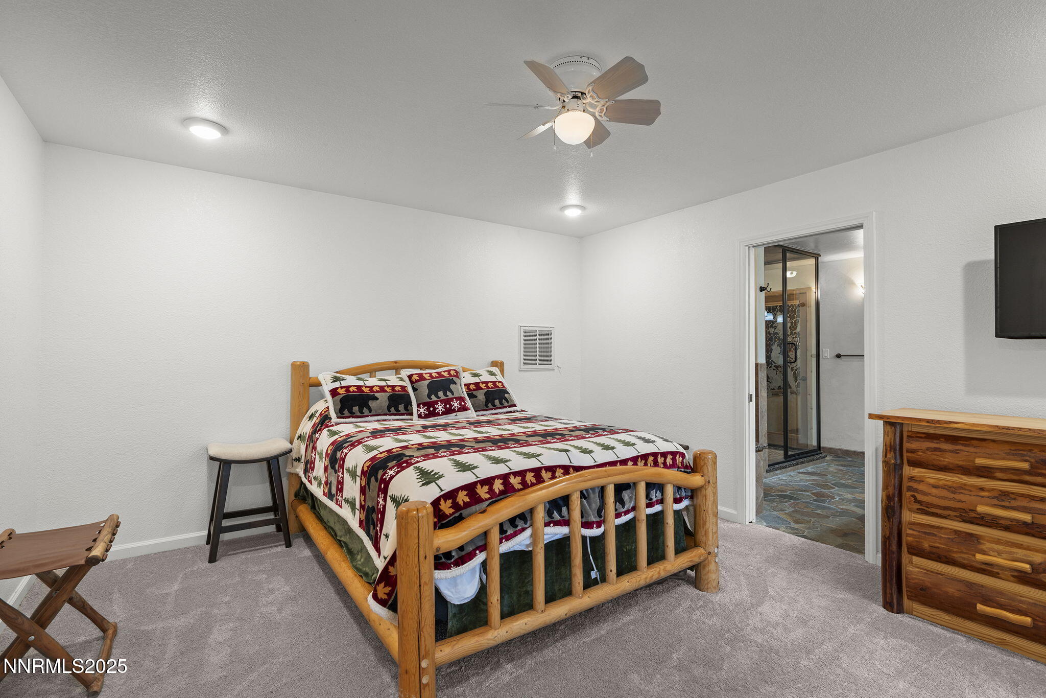 50 Sunridge Drive Reno, NV 89511 - Photo 17 of 29 a bedroom with a bed and a chandelier
