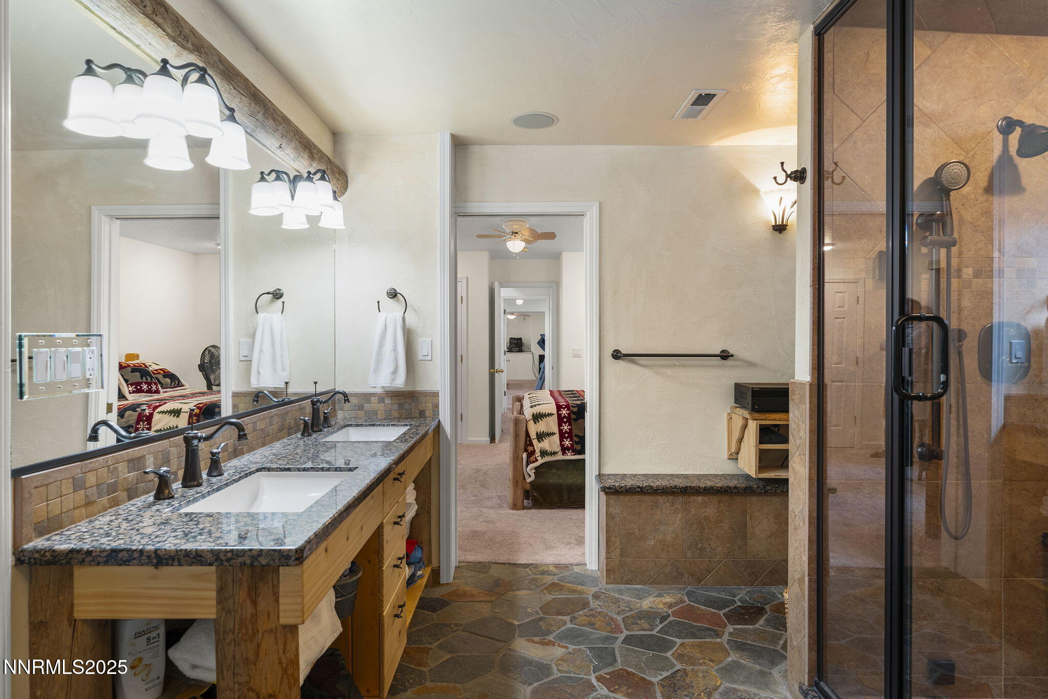 50 Sunridge Drive Reno, NV 89511 - Photo 18 of 29 a bathroom with a granite countertop sink a mirror and shower