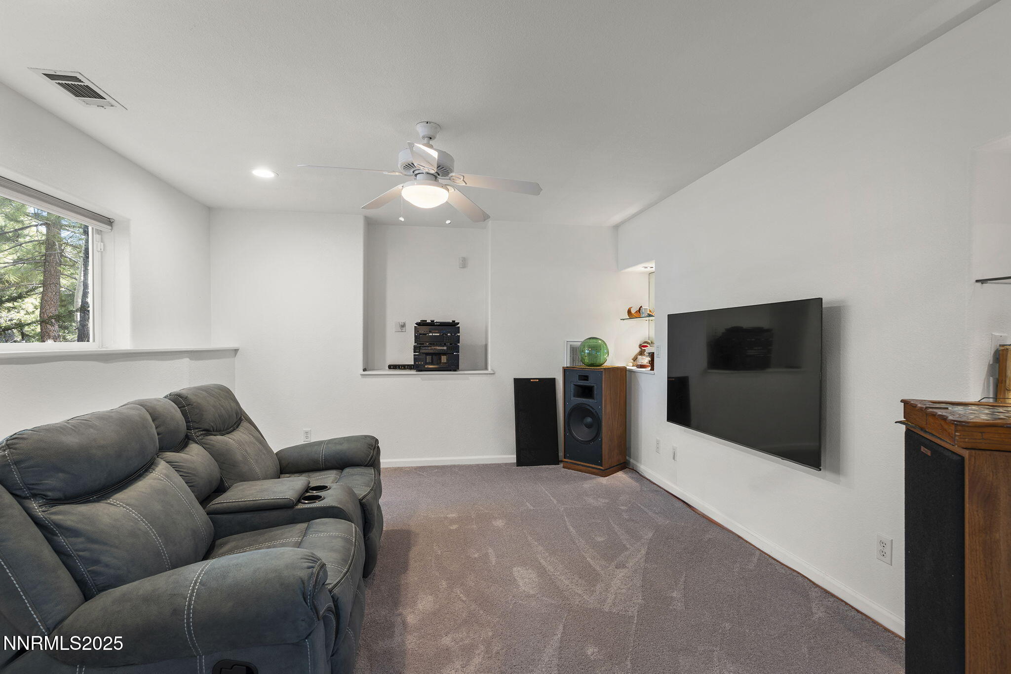 50 Sunridge Drive Reno, NV 89511 - Photo 24 of 29 a living room with furniture and a flat screen tv