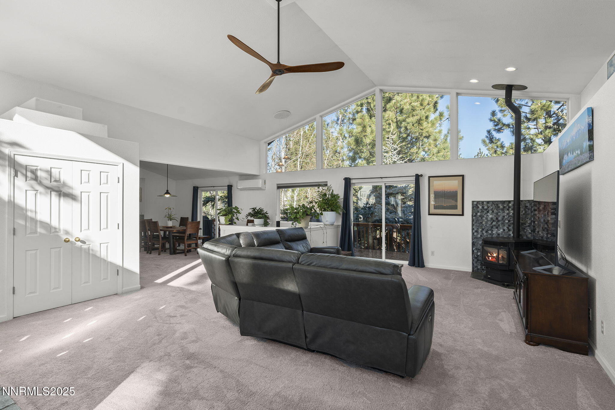 50 Sunridge Drive Reno, NV 89511 - Photo 5 of 29 a living room with furniture a flat screen tv and a large window