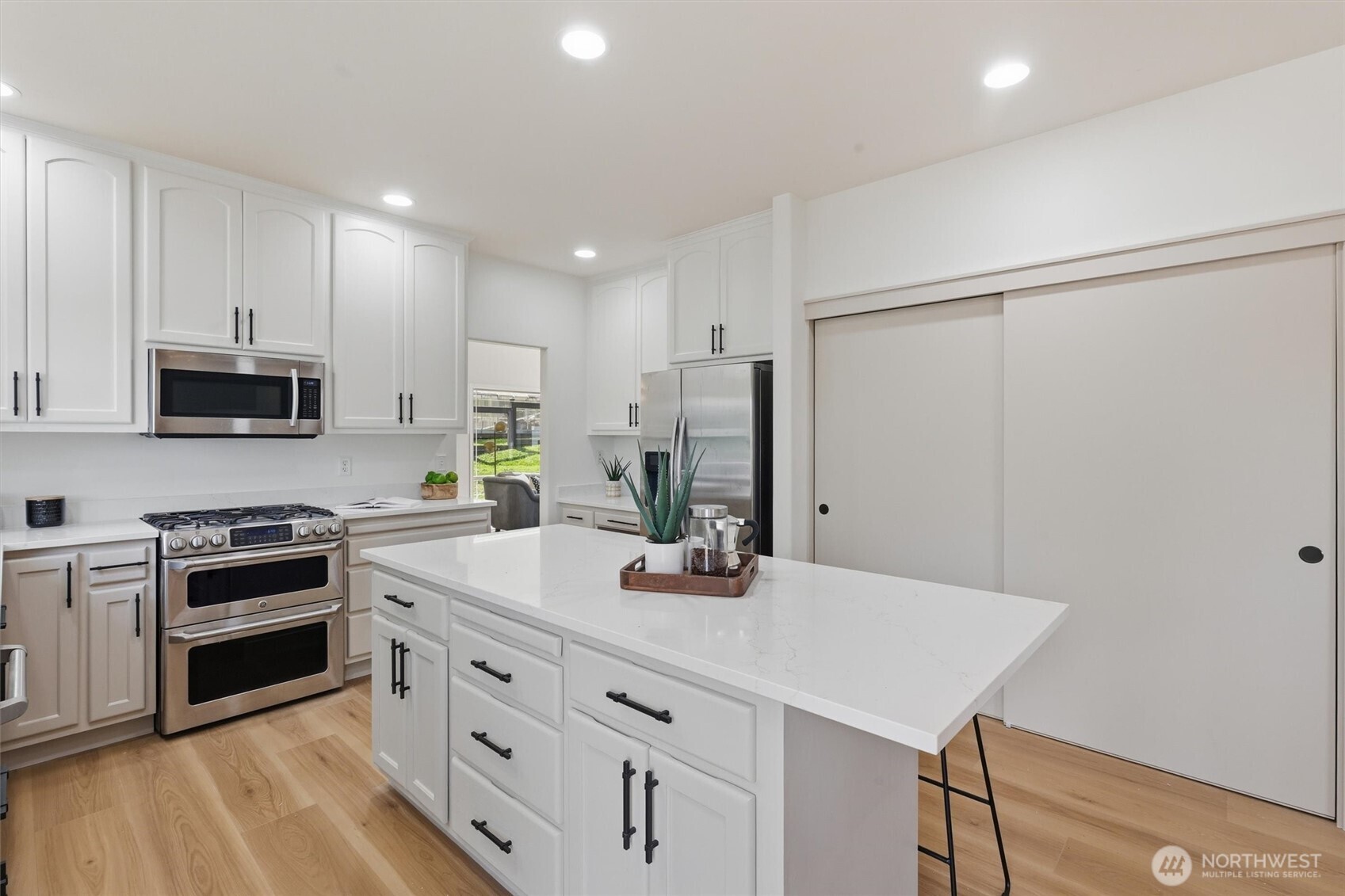 5523 East Wishon Road Snohomish, WA 98290 - Photo 12 of 39 a kitchen with stainless steel appliances a sink stove and refrigerator