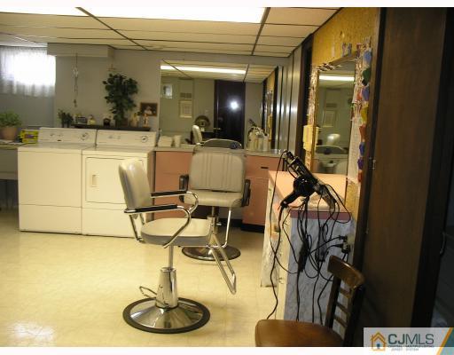 703 Old Post Road Edison, NJ 08817 - Photo 8 of 10 a bathroom with a sink and mirror