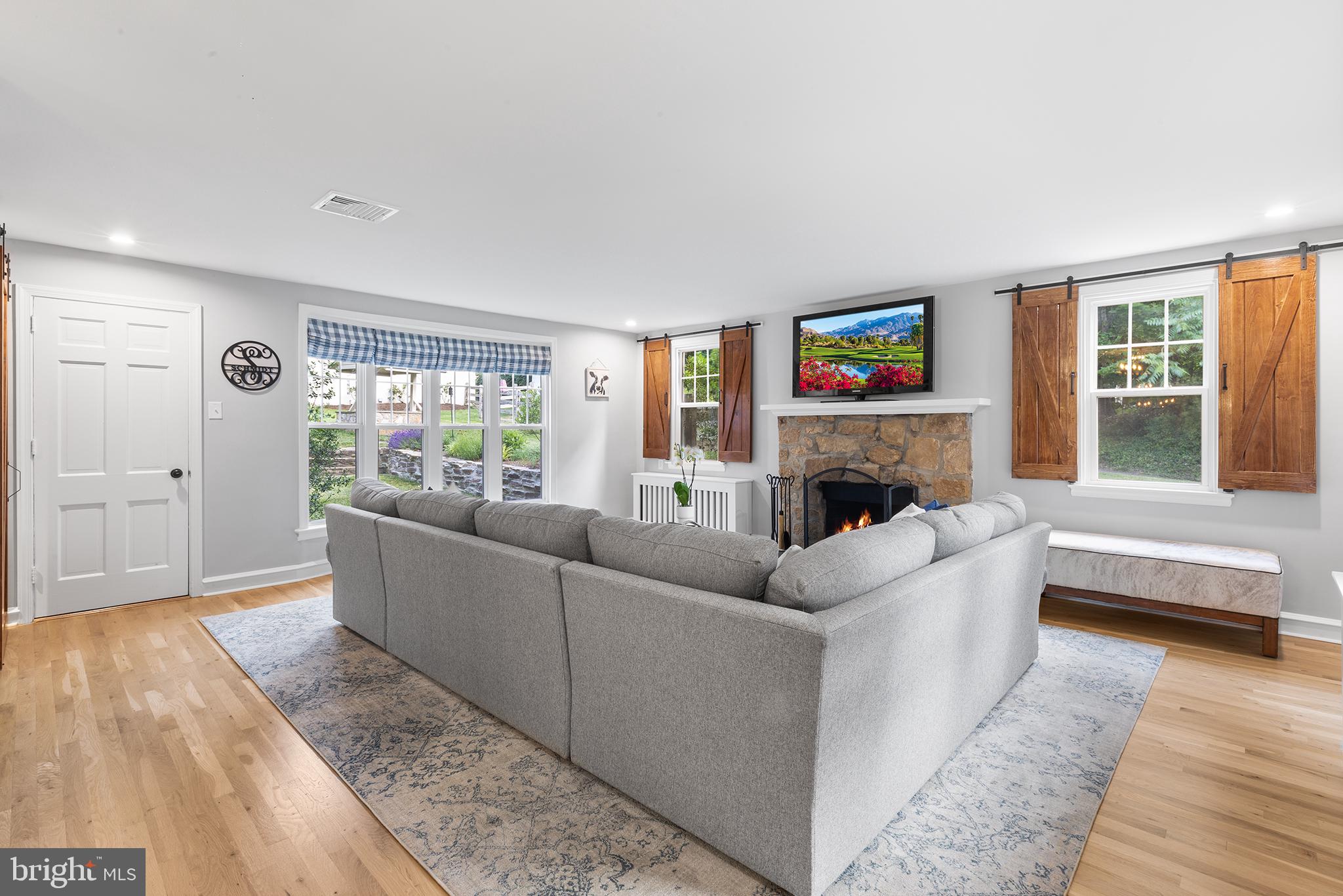 420 Berwyn Baptist Road Devon, PA 19333 - Photo 5 of 33 a living room with furniture a window and a fireplace