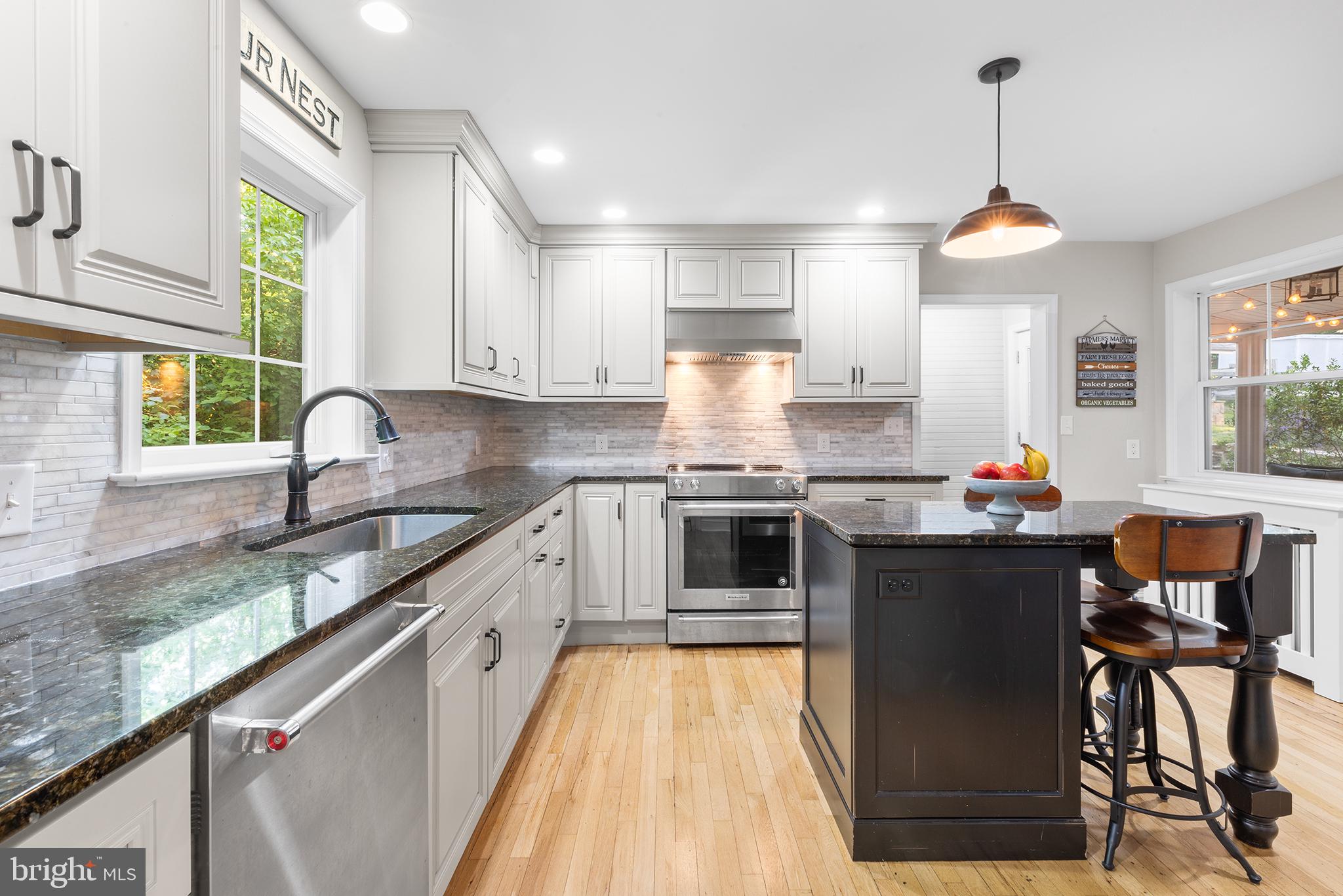 420 Berwyn Baptist Road Devon, PA 19333 - Photo 9 of 33 a kitchen with stainless steel appliances granite countertop a sink counter space and a window
