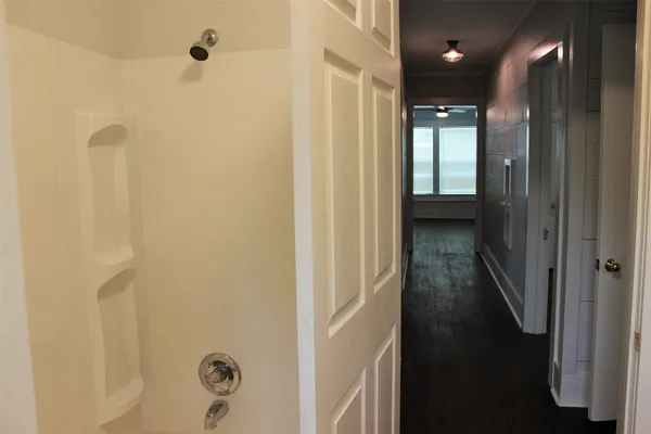 a bathroom with a shower and a sink