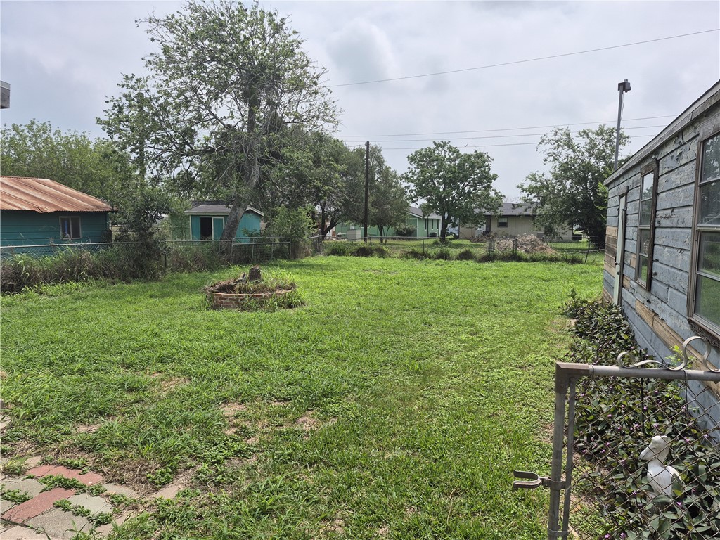 202 North Gregory Gregory, TX 78374 - Photo 17 of 19 a backyard of a house with table and chairs