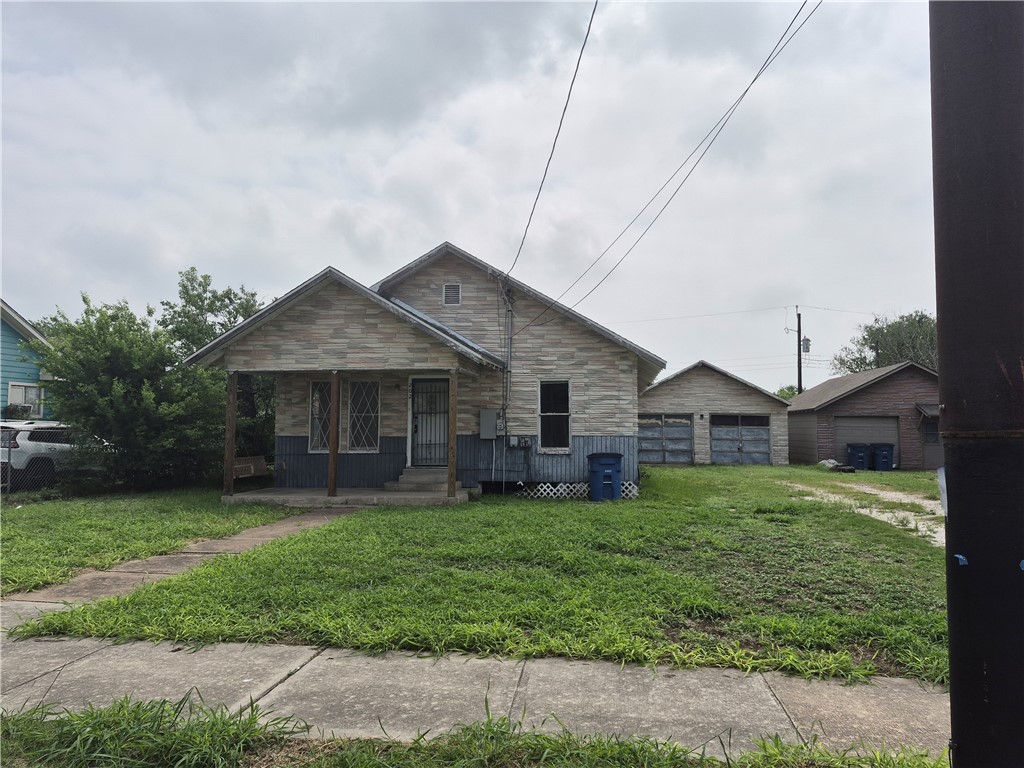 202 North Gregory Gregory, TX 78374 - Photo 2 of 19 a house view with a garden space