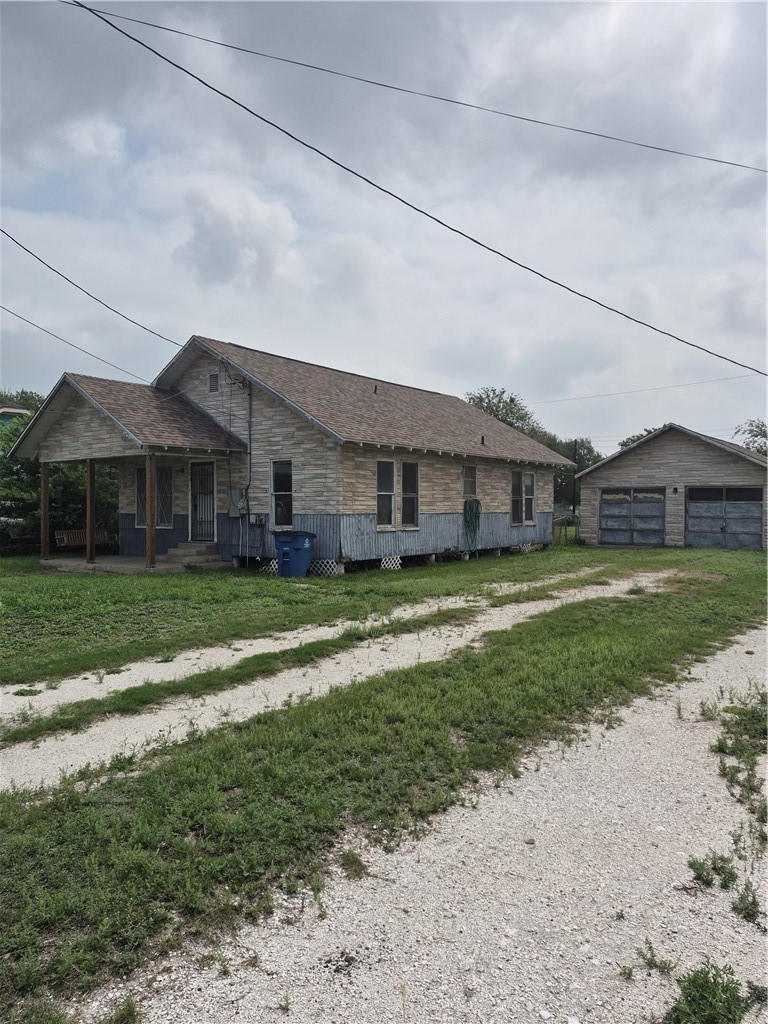 202 North Gregory Gregory, TX 78374 - Photo 4 of 19 a front view of a house with a yard