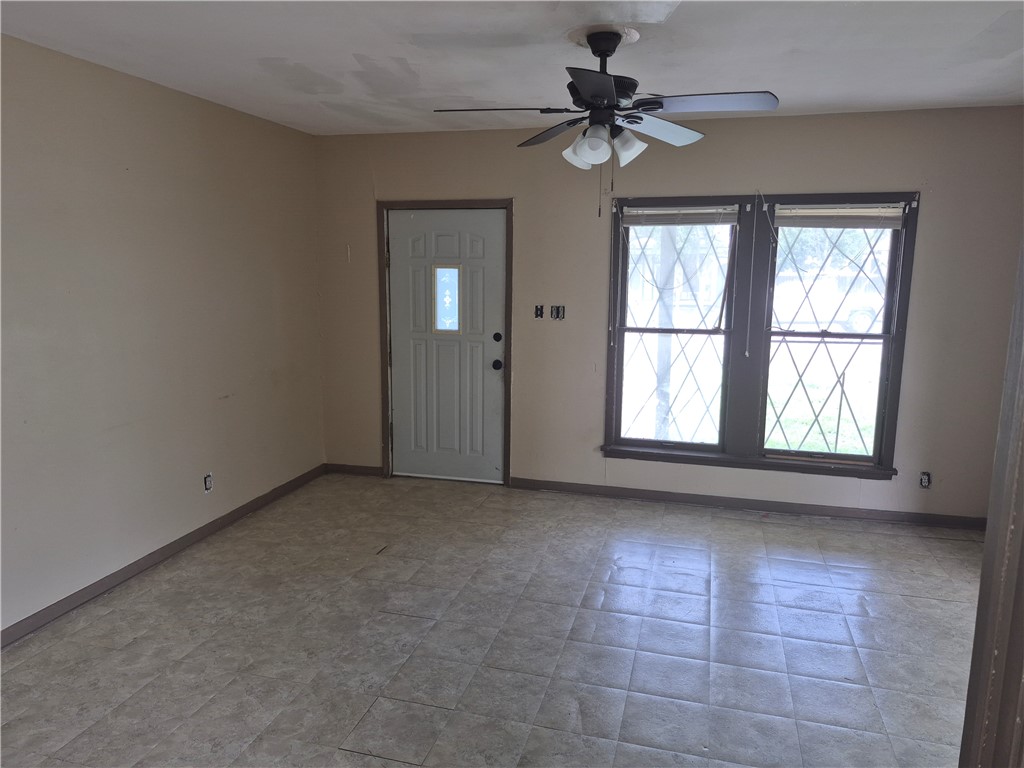 202 North Gregory Gregory, TX 78374 - Photo 5 of 19 a view of an empty room with a window