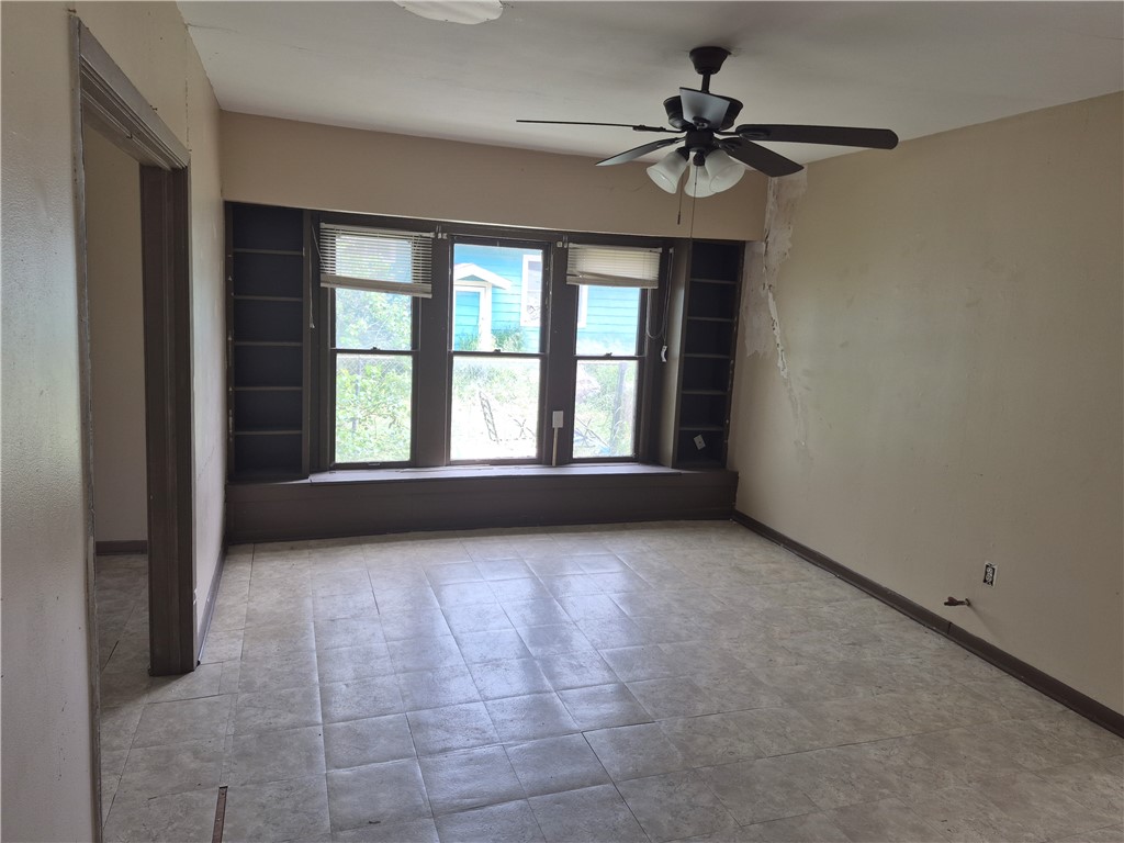 202 North Gregory Gregory, TX 78374 - Photo 7 of 19 a view of an empty room with a window