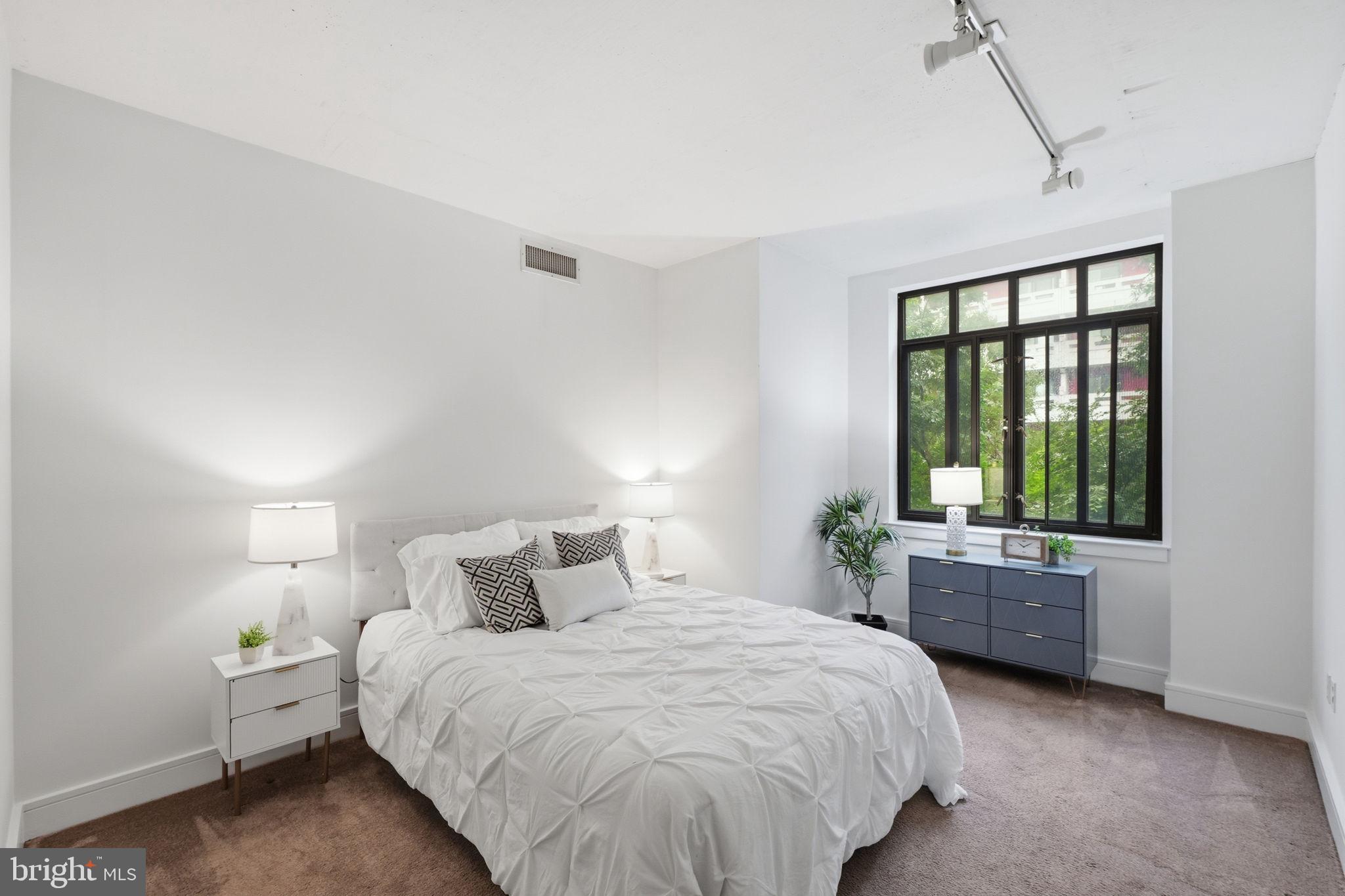 809 6th Street Northwest, Unit 22 Washington, DC 20001 - Photo 9 of 21 Bedroom 1 has carpet and large windows that open