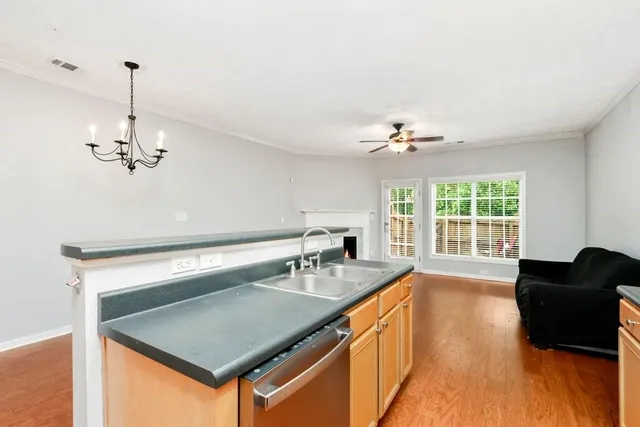 a kitchen with a counter space a sink and appliances