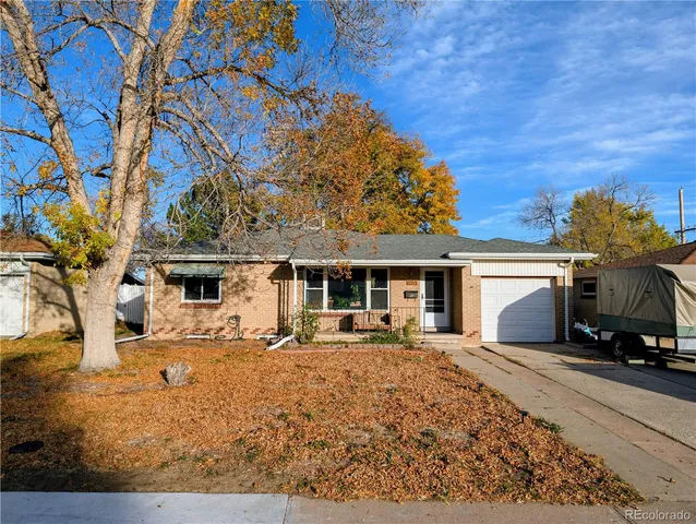 front view of a house with a tree