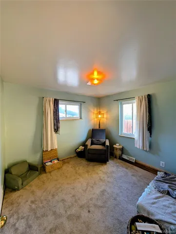 a living room with furniture window and a window