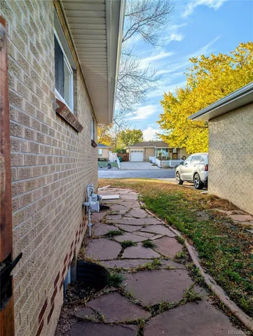 a view of a backyard with sitting area
