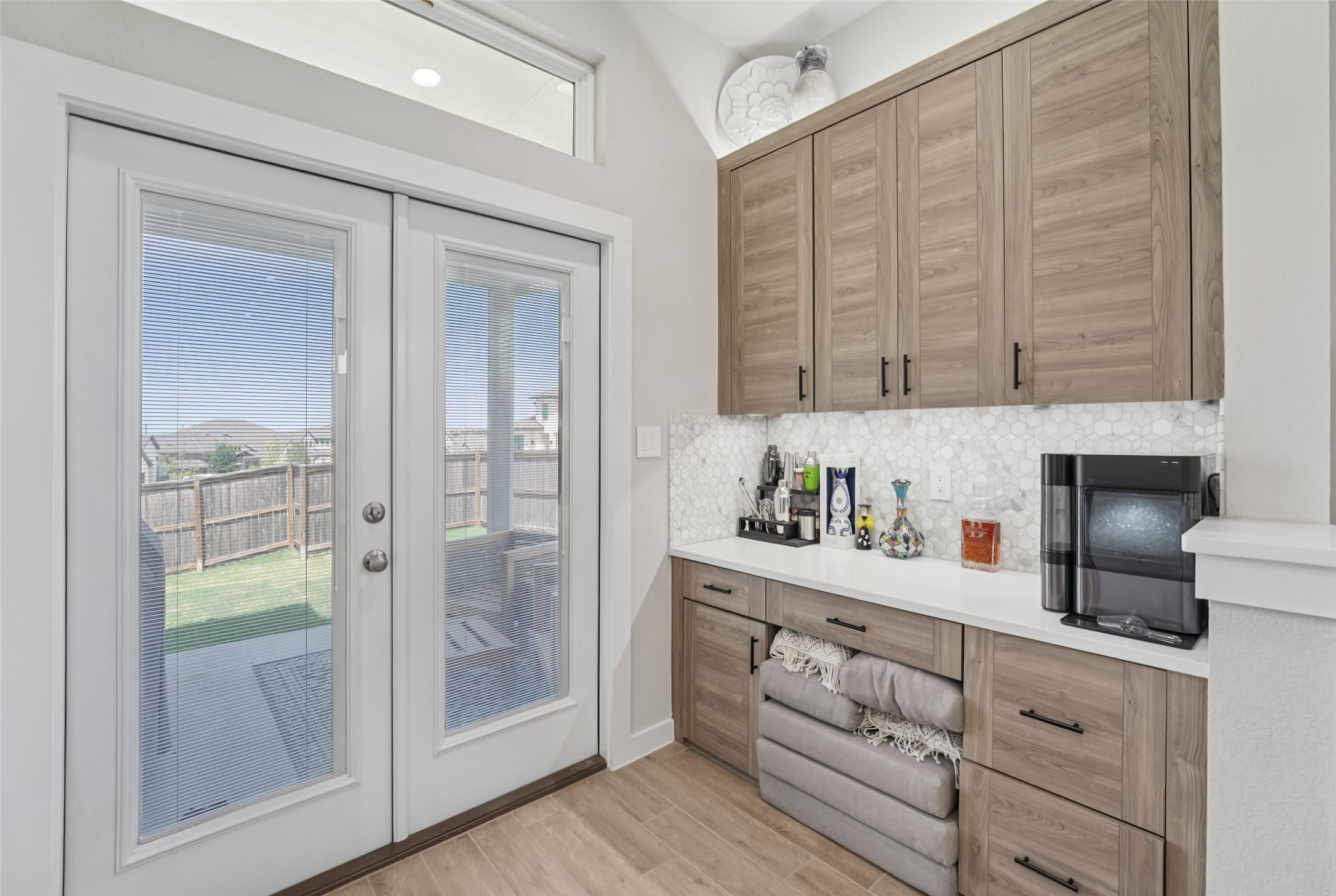 1108 Sweetspire Street Leander, TX 78641 - Photo 14 of 39 a kitchen with cabinets and window