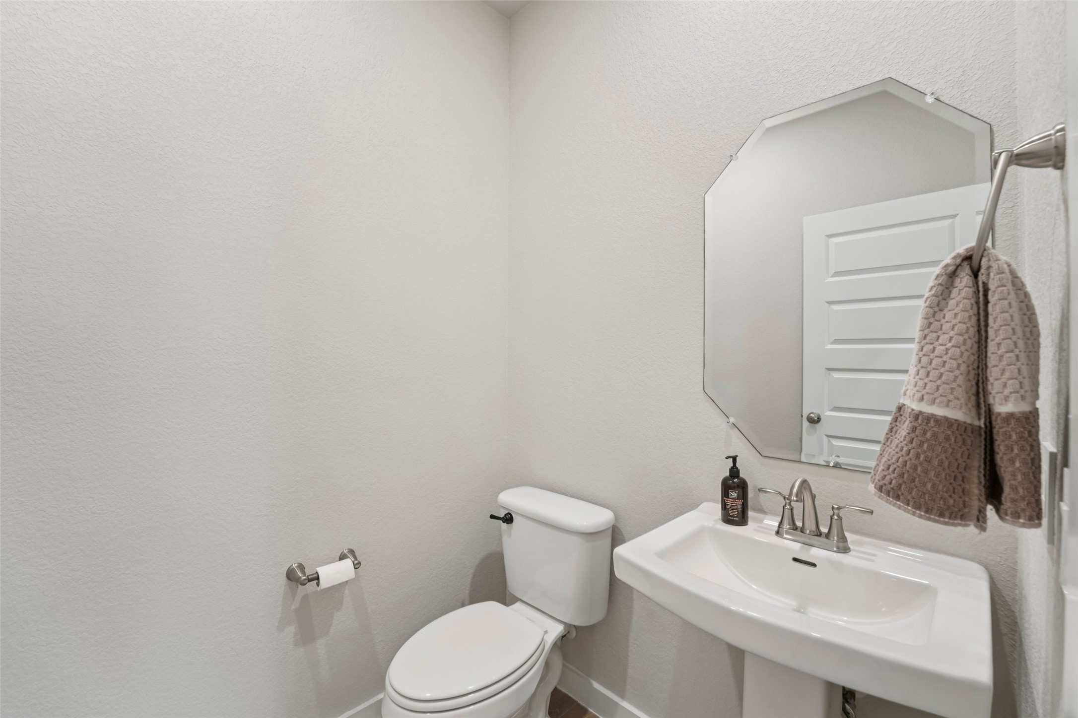 1108 Sweetspire Street Leander, TX 78641 - Photo 20 of 39 a bathroom with a toilet sink and mirror