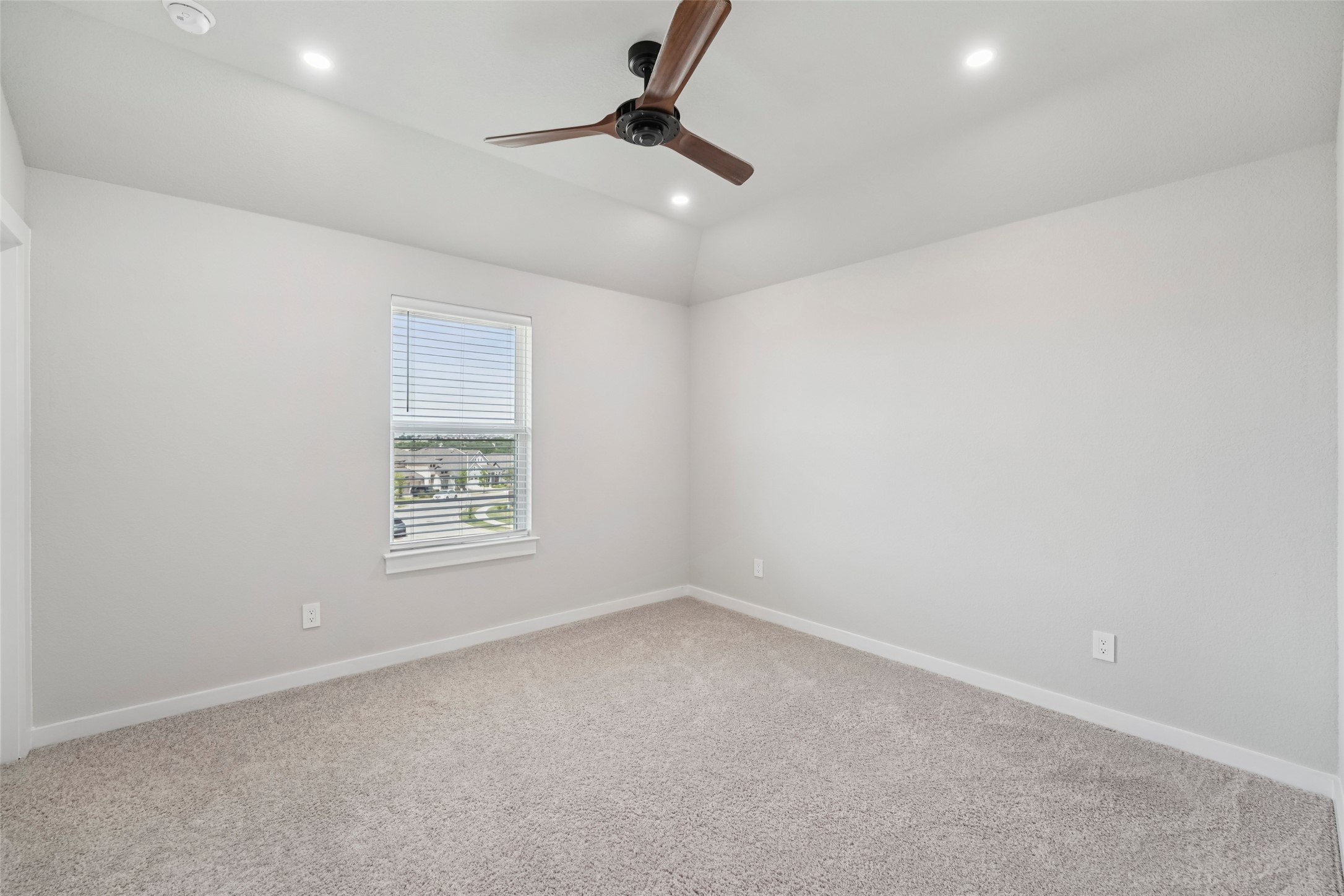 1108 Sweetspire Street Leander, TX 78641 - Photo 30 of 39 an empty room with a ceiling fan and window