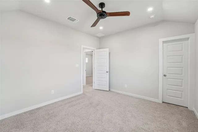 a very nice looking room with a ceiling fan