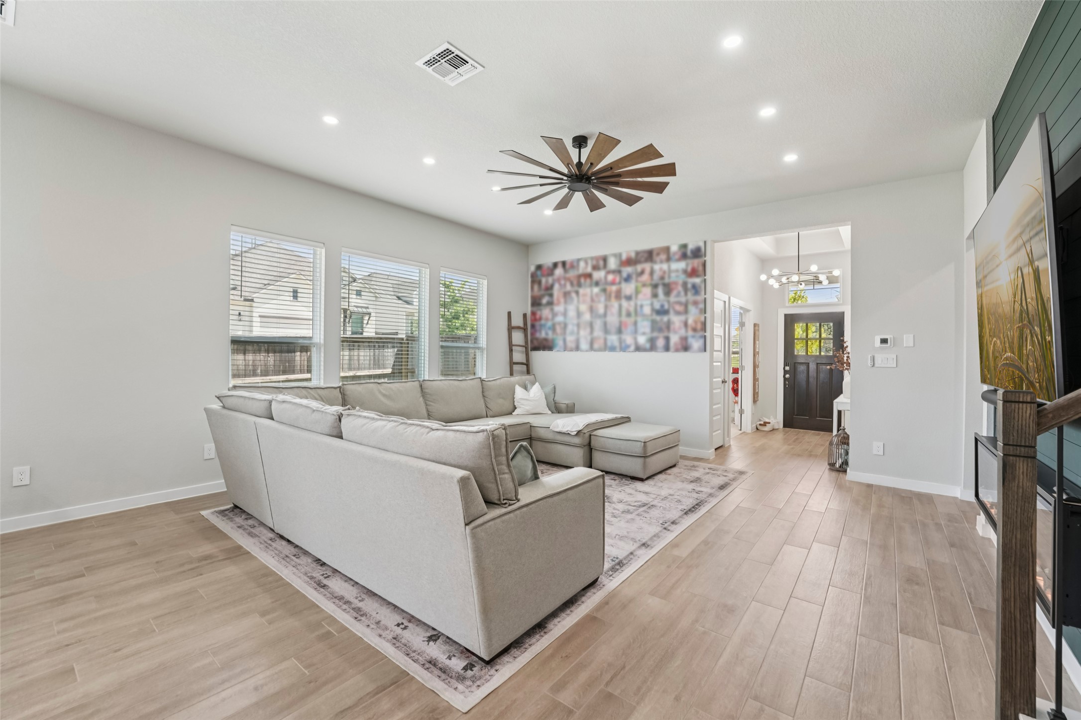 1108 Sweetspire Street Leander, TX 78641 - Photo 5 of 39 a living room with furniture and a flat screen tv