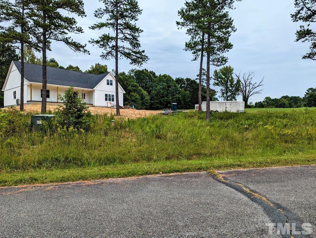 Lot 18 Grace Stone Drive Clarksville, VA 23927 - Photo 8 of 25 a front view of a house with a yard and garage