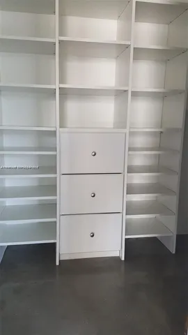 a view of a room with shelves