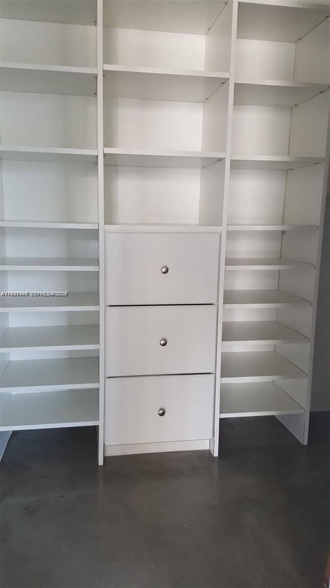 455 Northeast 25th Street, Unit 407 Miami, FL 33137 - Photo 35 of 50 a view of a room with shelves