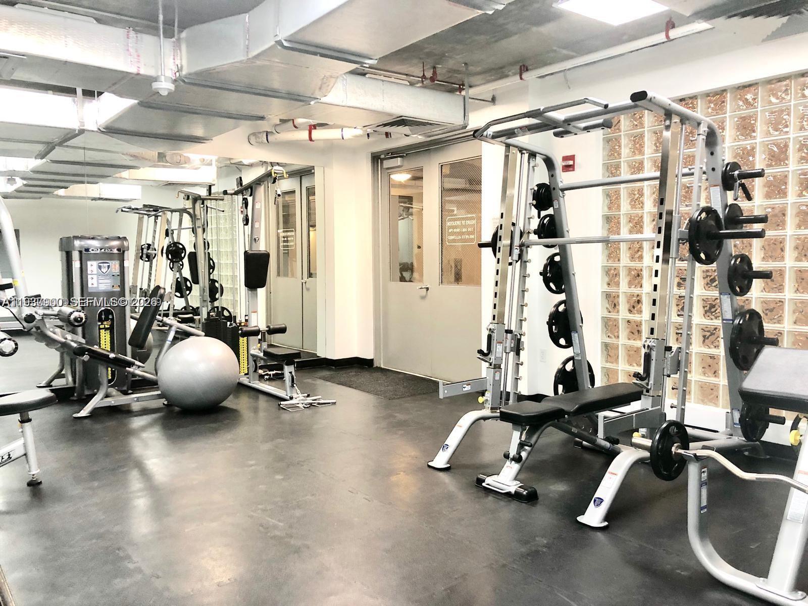 455 Northeast 25th Street, Unit 407 Miami, FL 33137 - Photo 40 of 50 a room with gym equipment