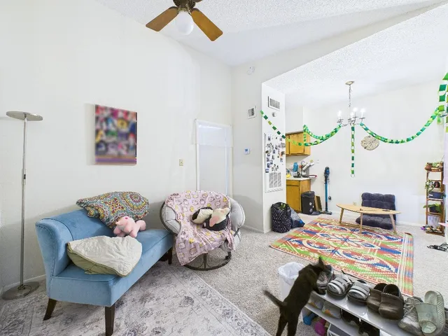 a bedroom with a bed and a couch