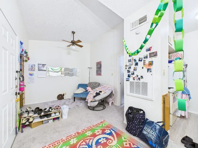 a bedroom with furniture and a window