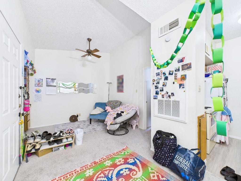 3316 Guadalupe Street, Unit 321 Austin, TX 78705 - Photo 2 of 13 a bedroom with furniture and a window