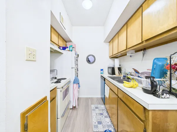 a utility room with sink dryer and washer
