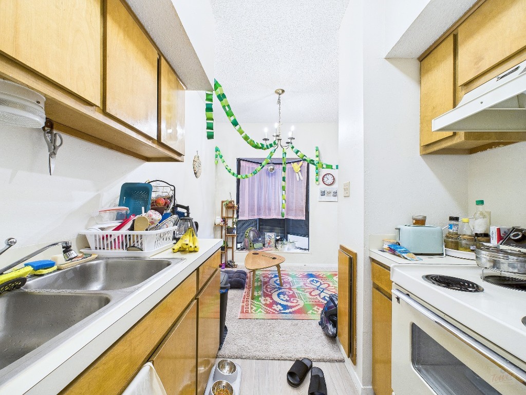 3316 Guadalupe Street, Unit 321 Austin, TX 78705 - Photo 6 of 13 a utility room with sink dryer and washer