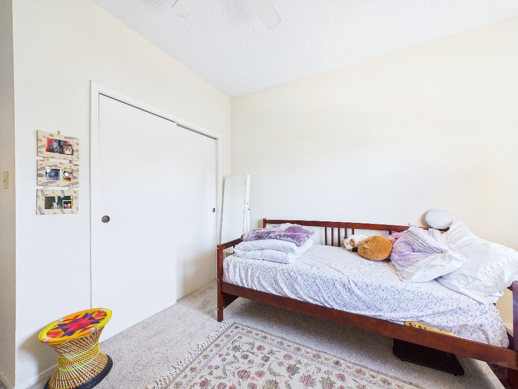 3316 Guadalupe Street, Unit 321 Austin, TX 78705 - Photo 10 of 13 a bedroom with a bed and a window