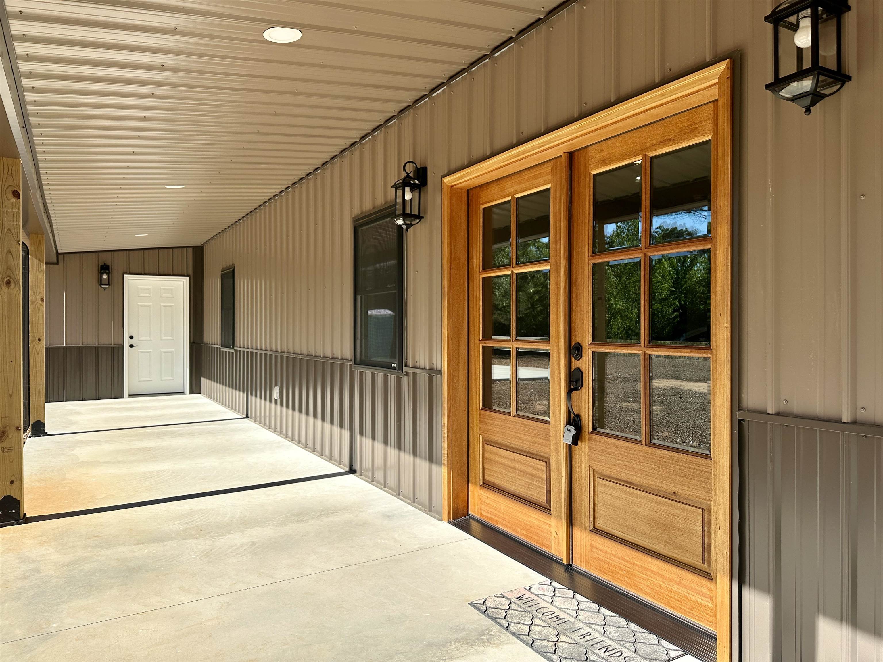 1137 Arl Bailey Road Finger, TN 38334 - Photo 3 of 40 a view of a porch with wooden floor and floor to ceiling window