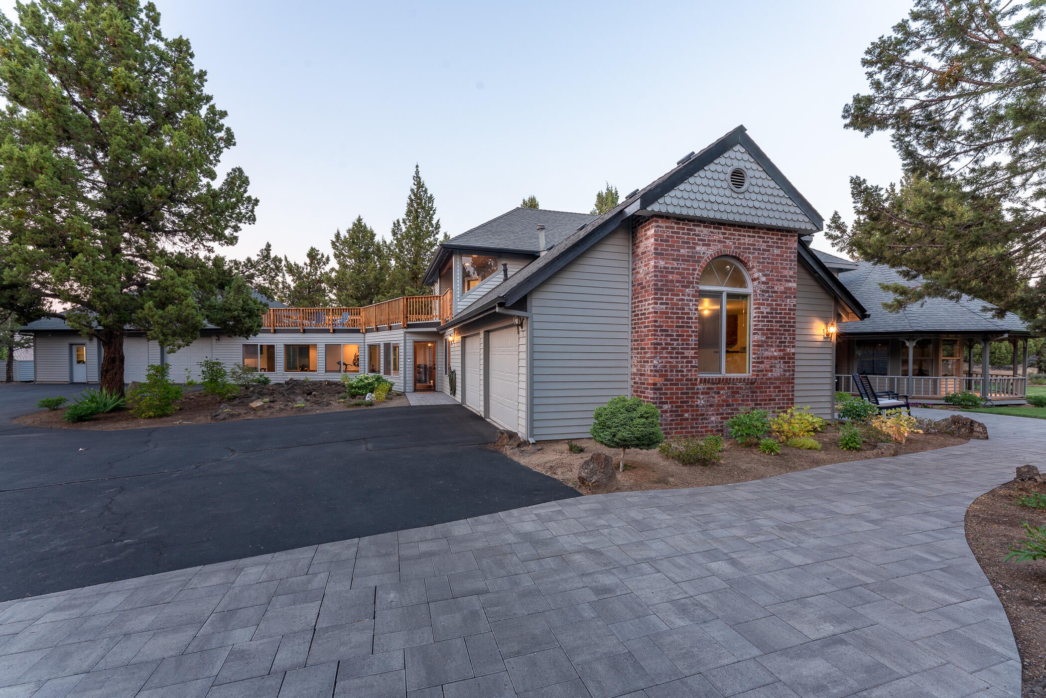 64300 Crosswinds Road Bend, OR 97703 - Photo 2 of 61 Extensive pavers and exceptional landscaping all around the home