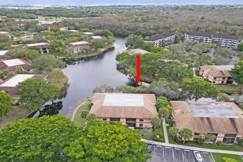 an aerial view of houses with outdoor space and river